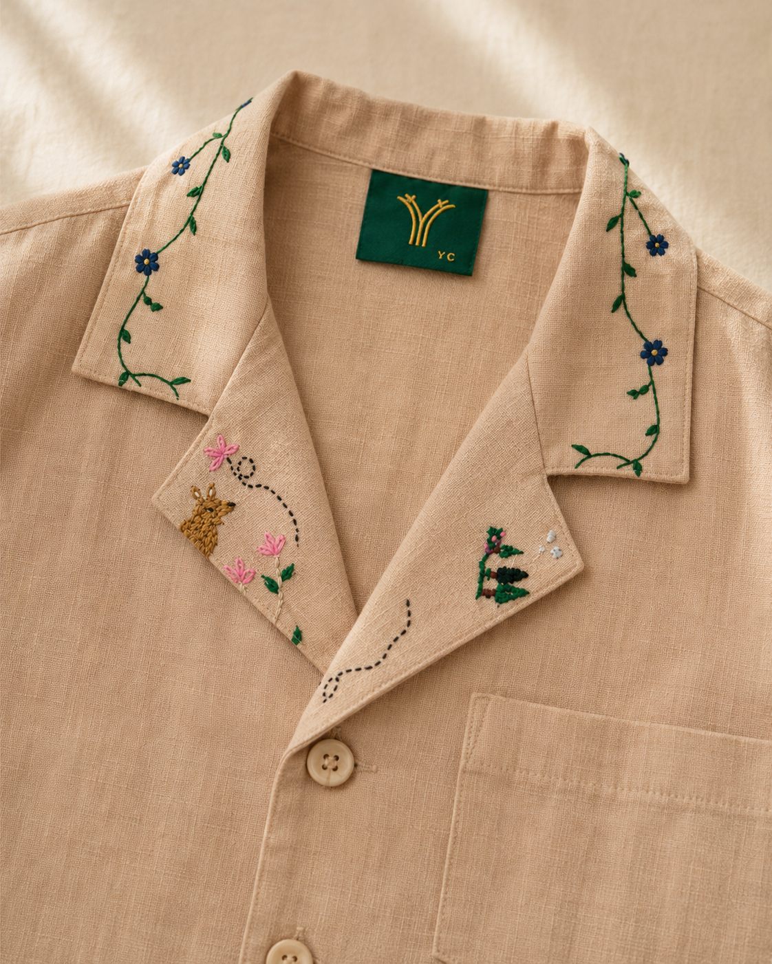 Hand-embroidery detail on a YAAN’s collar